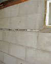 Severely buckling foundation walls in a home in Wilmore in need of repairs.