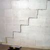 A diagonal stair step crack along the foundation wall of a Corbin home