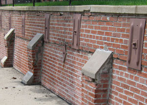 Rusted wall plate anchors in a retaining wall repair in Whitley City.