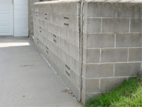 A retaining wall separating from the adjoining walls in Stearns