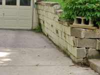 a failing retaining wall around a driveway in Lexington