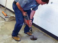 Coring the concrete of a concrete slab floor in Versailles