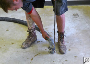 Mudjacking a damaged foundation floor in a Shelbyville home.