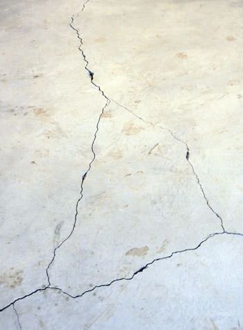 severely cracked, heaving slab floors in a home in East Bernstadt