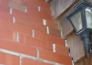 a repaired chimney in Mc Kee that had shown serious foundation damage and was repaired with a helical pier system.