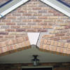 Major tuckpointing on a home archway over a door, with tuckpointing several inches wide that has failed on a Lexington home