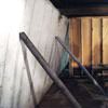 Temporary foundation wall supports stabilizing a Frankfort home