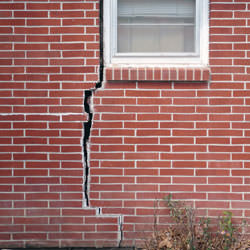 A foundation with a large crack that's wider at the top than on the bottom in Columbia