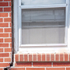 A gap in a window along the outer wall due to foundation settlement of a Harrodsburg home.