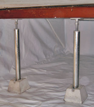 Crawl space jack posts installed in conjunction with a crawl space vapor barrier in Columbia