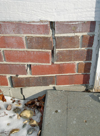 garage walls cracking due to street creep