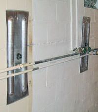 A foundation wall anchor system used to repair a basement wall in Nancy