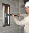 Tightening a wall anchor plate in Frankfort, Kentucky