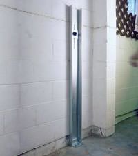 A failing foundation wall repaired with a foundation wall channel anchor system in a Frankfort home.