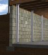 I-beam foundation wall supports installed in a Waynesburg basement.