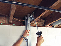 Straightening a foundation wall with the PowerBrace™ i-beam system in a Somerset home.