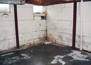 A failed, rusty i-beam foundation wall system installed in Columbia.