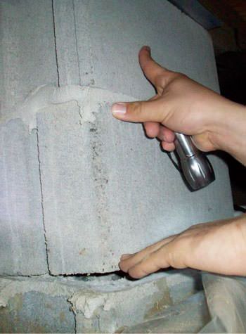 a completely failing concrete crawl space support pillar in Pine Knot
