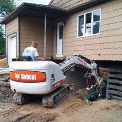 Excavating to expose the foundation walls and footings for a replacement job in Campbellsville