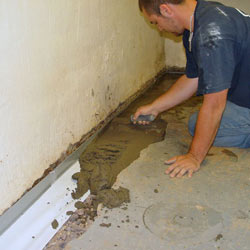 Testing a French drain system in a Campbellsville home.