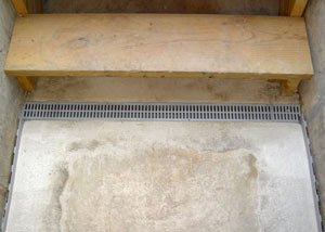 Our grated drain system installed on a leaking basement staircase in Columbia.