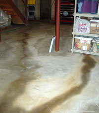 Flooding entering a basement through a floor crack in Cynthiana