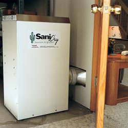 A basement dehumidifier with an ENERGY STAR® rating ducting dry air into a finished area of the basement  in Pine Knot