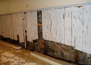 A wet, flooded finished basement in Monticello