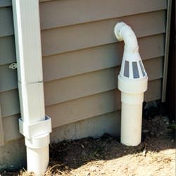 A grated sump pump discharge line fitting in Lebanon