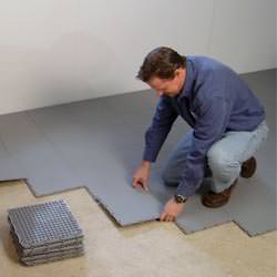 basement subfloor tiles being installed by a contractor in East Bernstadt