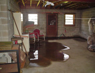 a flooded basement floor in a Pine Knot home