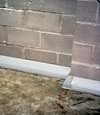 Our baseboard drain system installed on a corner in a Middlesboro basement.
