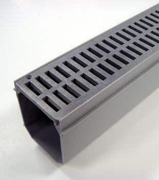 A closeup of our grated basement drainage pipe system, installed in Corbin