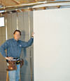 Installing wall panels on top of our basement wall insulation in Shelbyville
